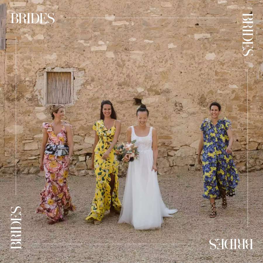 a bride and her bridesmaids who are wearing colorful printed dresses