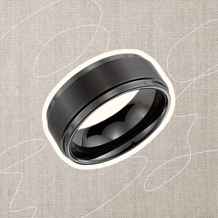A black men's wedding band we recommend on a simple background