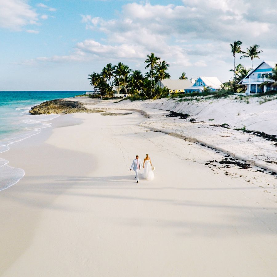 A bride and groom on the beach in the Bahamas, a Caribbean beach wedding destination