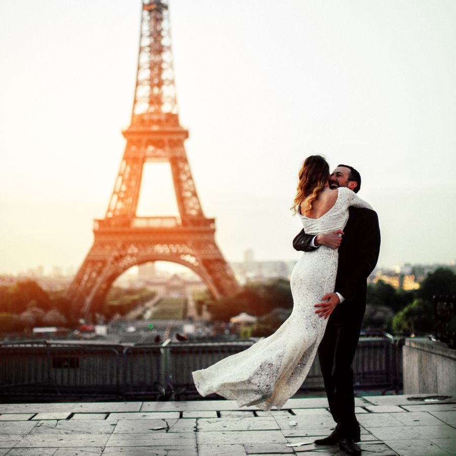 A bride and groom embrace during their destination wedding in Paris, France.