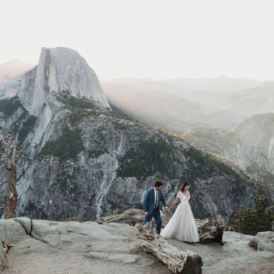 A couple walking through the mountains during their elopement.