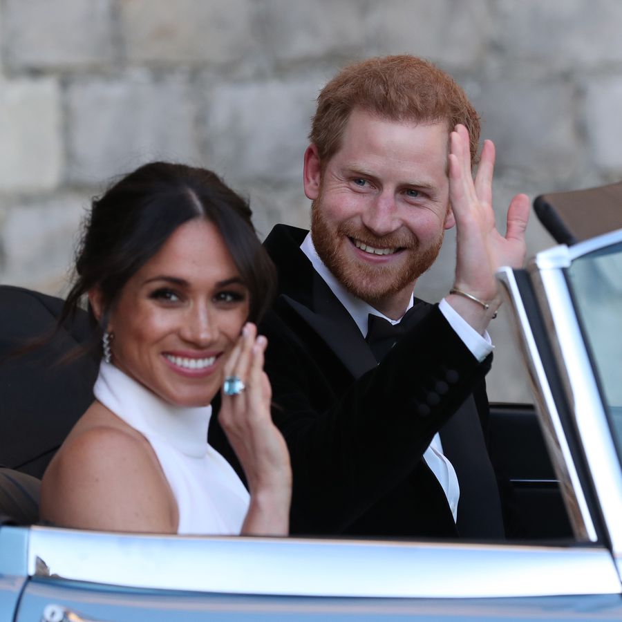 Meghan Markle and Prince Harry riding in convertible after wedding ceremony
