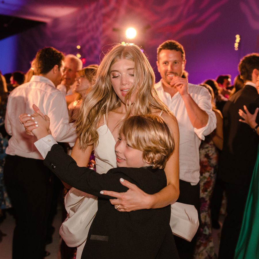 bride dancing with young boy