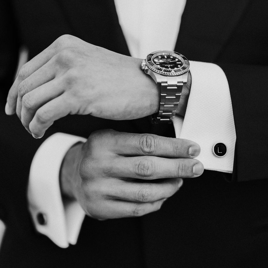 cuffs of a suit and a watch