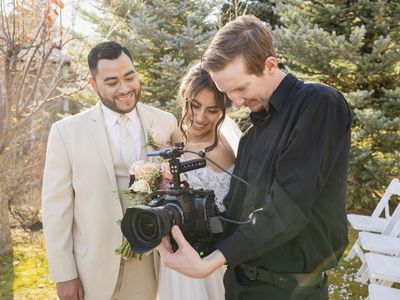 Bride and Groom with Wedding Photographer