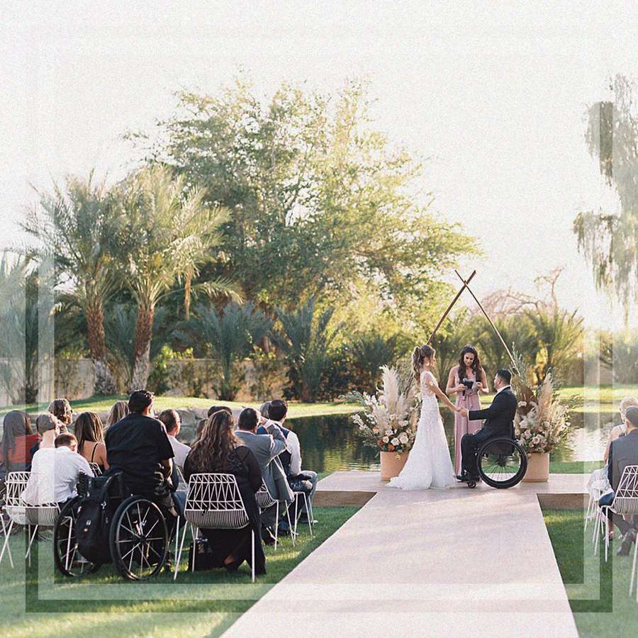 Bride and groom in wheelchair at wedding ceremony