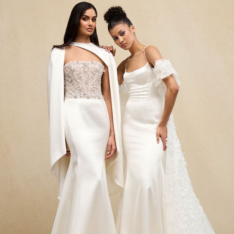 two brides wearing fit and flare gowns