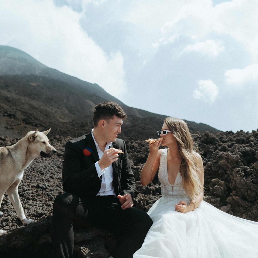 Bride and groom on mountain at destination wedding