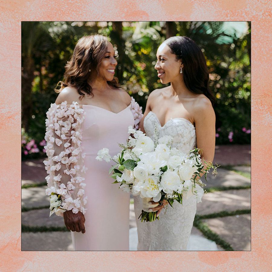 bride with her mother in long sleeve floral dress