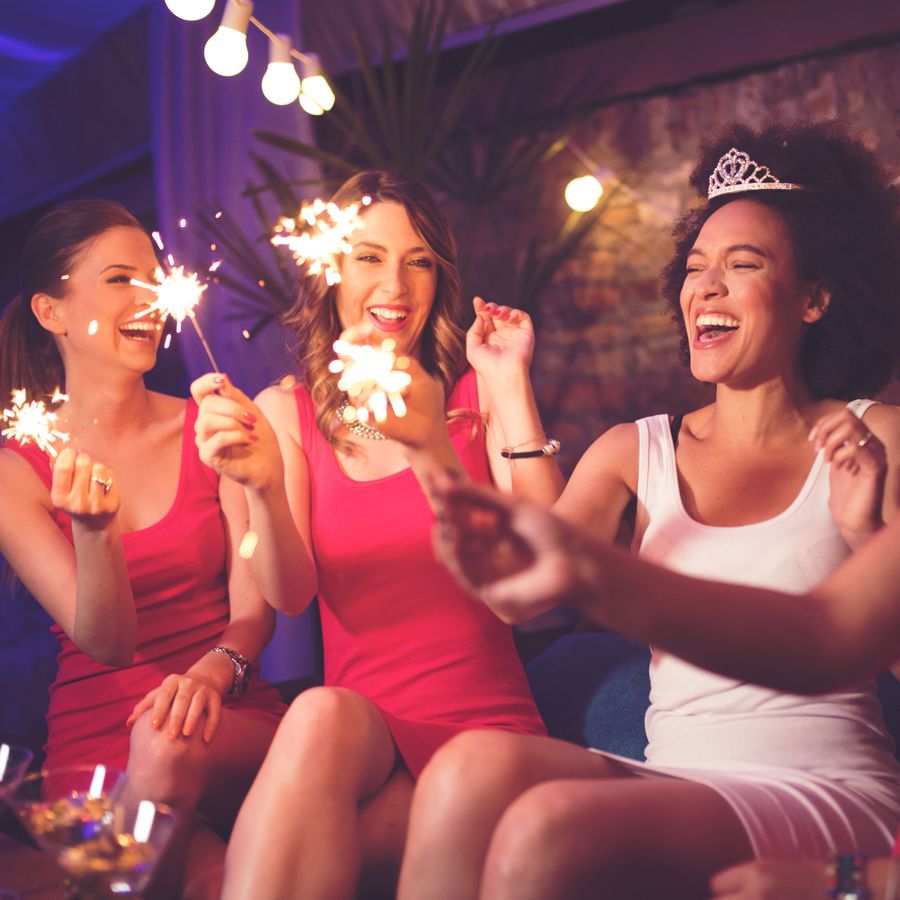 bride and friends with sparklers at bachelorette party