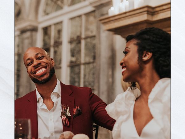 Couple laughing at wedding rehearsal dinner