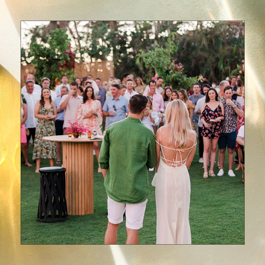 bride and groom give toast at engagement party