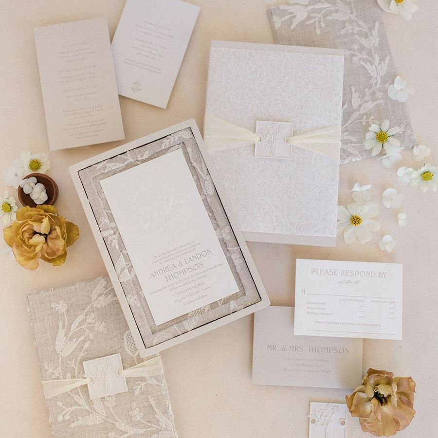 A neutral-toned linen boxed wedding invitation.